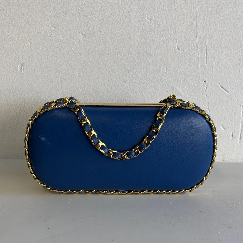 Chic Blue Pill Clutch with Gold Chain Accent